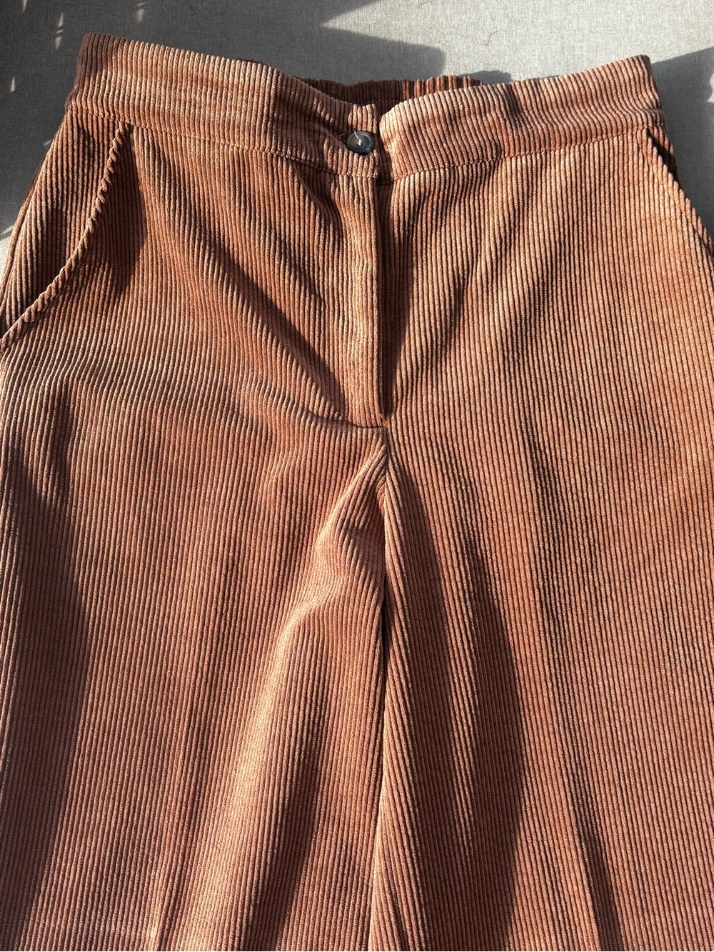 Brown/burnt orangey corduroy pants